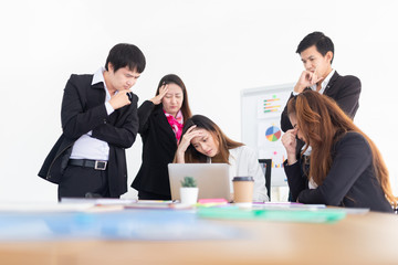 asian officer team feeling stress and serious after them project has problem, they looking performance organization result with laptop, development and management organization