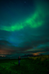 Naklejka na ściany i meble bright northern lights (aurora borealis) in Iceland