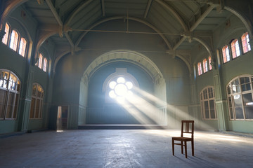lost spaces, big abandoned dancing hall with big white windows, green walls, dust on the floor, sun...