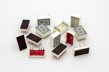 Electronic components, old 7 segments single digit led display on white background.