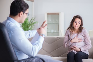Pregnant woman visiting psychologist doctor