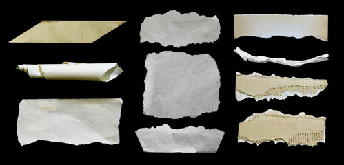 Set of torn paper texture on black background, copy space.