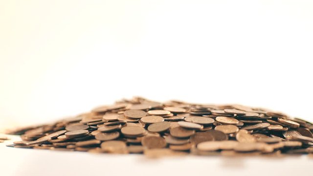 White-gloved hands scooping up a pile of gold coins. They sort out and scatter money.On white background. Garland. Money glitters.