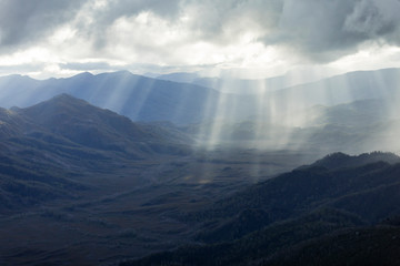 Heavenly light over dramatic mountains in Tasmania, Australia