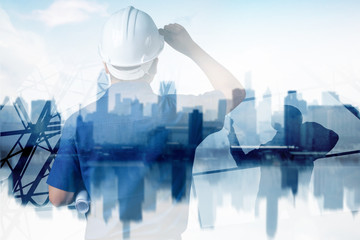 smart city and high construction development concept, double exposure engineer touching helmet to...