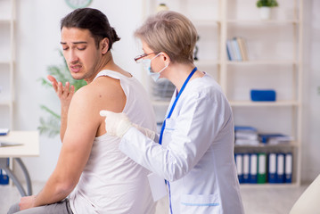 Fototapeta premium Young patient visiting doctor in hospital