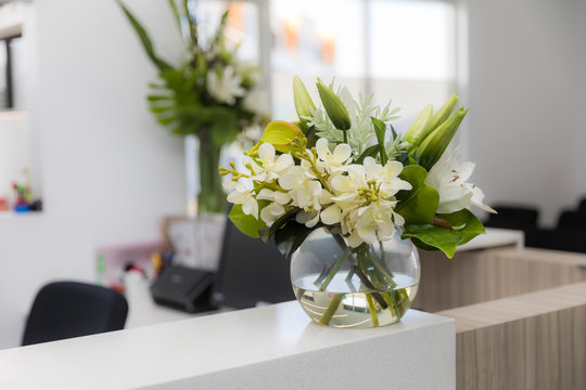 Doctors surgery reception desk flowers