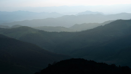 Ariel view of landscape mountain rain forest layer with fog in the morning.