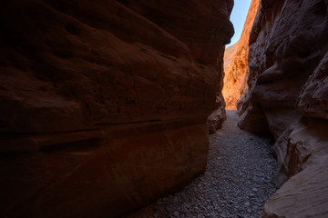 Orange Rocks Glow At The End of Slot Canyon