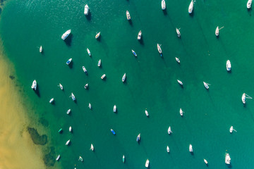 Boats sailing out of a channel in Northern Sydney