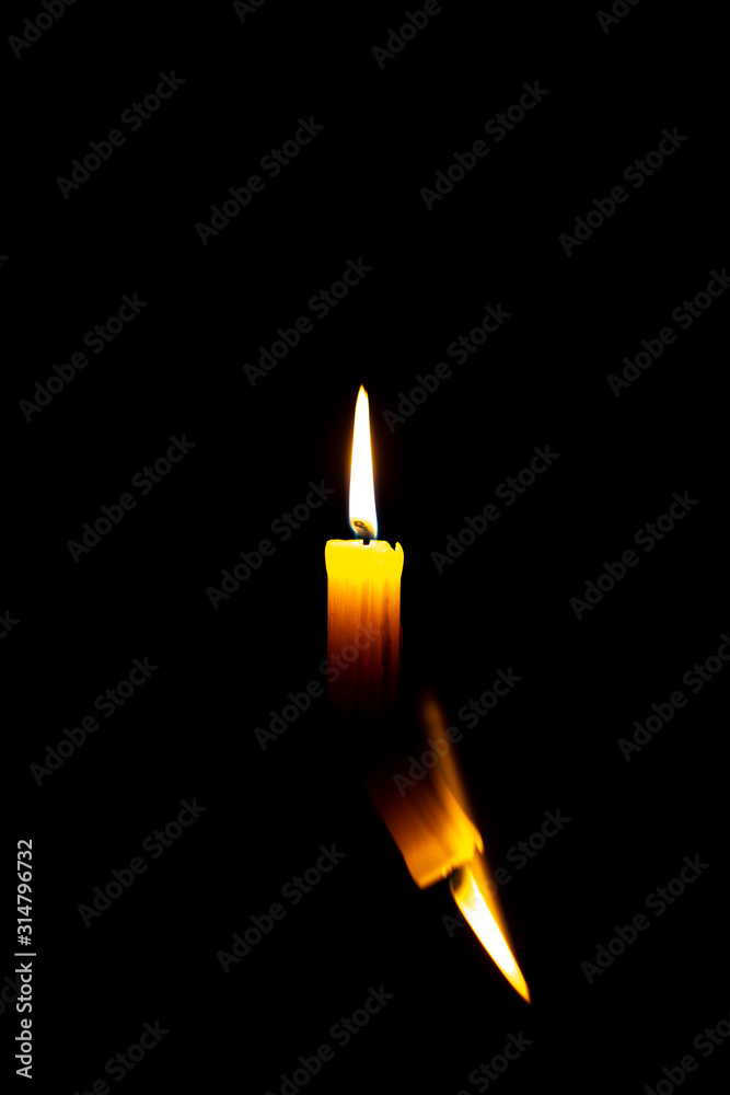 Wall mural candle in the dark