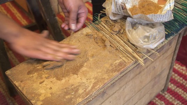 India, Karnataka, Mysore, Devaraja flower market, hand rolling incense sticks