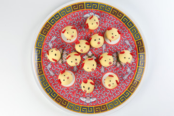 Chinese New Year rat mouse shaped cookie on decorated plate ..