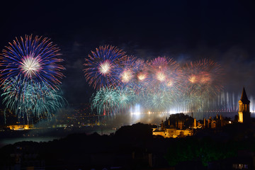 Blue Republic Day fireworks on the Bosphorus with Bridge lights and Topkapi and Dolmabahce Palaces Istanbul