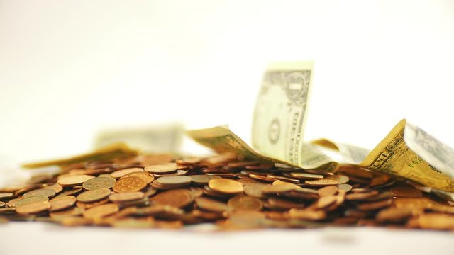 White-gloved hands scooping up a pile of gold coins. They sort out and scatter money.On white background. Garland. Money glitters.