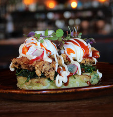 KOREAN FRIED CHICKEN OKONOMIYAKI: ⁣⁣ Japanese Pancake⁣⁣ Citrus Wilted Spinach⁣⁣ Crispy Fried Chicken⁣⁣ Poached Eggs⁣⁣ Kewpie Mayo⁣⁣ Korean Sweet and Sour Hot Sauce⁣