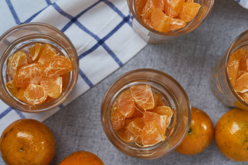 The prepared tangerine in a drinking glass