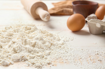 Heap of flour on table, closeup
