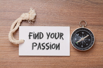 Find your passion - motivation phrase handwriting on label with compass