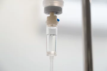 Fotobehang Saline solution intravenous iv drop drip in hospital. © marchsirawit