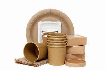 Eco kraft paper tableware. Paper cups, dishes, fast food containers, paper napkins isolated on white background. Recycling concept. Zero waste.