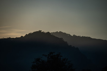 Fototapeta premium Mountain landscape with flare of the sun rise.