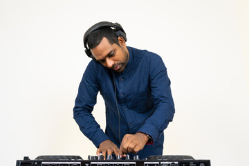 Fototapeta na wymiar Male DJ playing music on white background