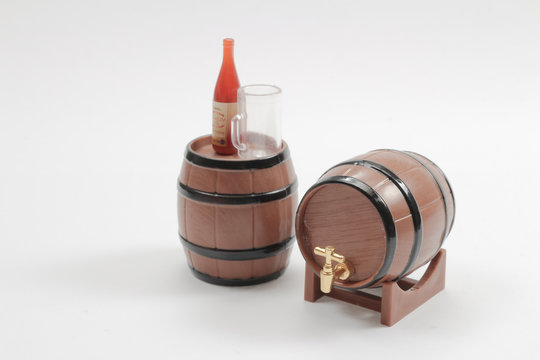 scale Wooden barrel with tap isolated on white