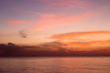 Fototapeta na wymiar Sea pink sunset. Beautiful color clouds.
