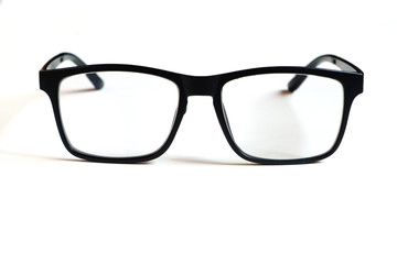 Transparent glasses, black frame isolated on a white clean background.