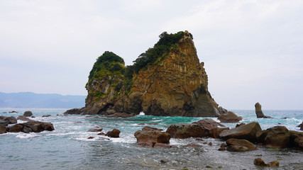 Rocky volcanic islands in turquoise blue water off the coast of Japan Aburatsu. incredible beaches and cliffs on the islands of the Pacific Ocean, Asia