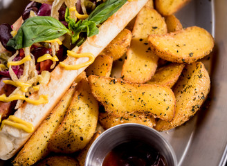 Hotdogs and French fries on a dishes. Fast food meal. Restaurant.