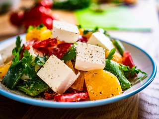  Fresh greek salad on wooden background