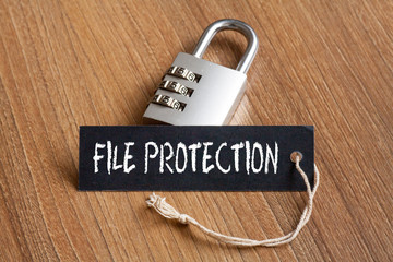 File Protection words written on tag label with combination padlock