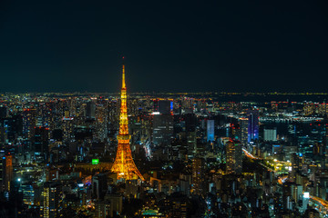 Tokyo Tower,  communications and observation tower in Shiba-koen, Minato and aerial Tokyo cityscape twilight view from Roppongi Hills, a must travel destination in Tokyo