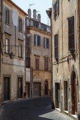 Fototapeta na wymiar VITERBO / ITALY - JULY 2015: Street in the historic centre of Veterbo town, Italy