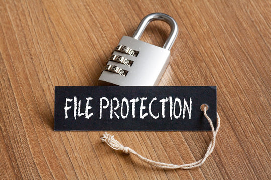 File Protection words written on tag label with combination padlock