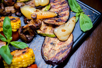 Tasty grilled vegetables on big plate. Healthy food. Restaurant.