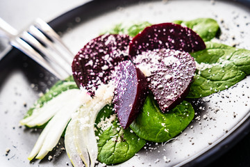  Beetroot with cottage cheese on black, stone plate