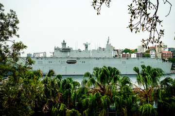 Australian's battleship side view surrounded with jungles, trees, and forests.