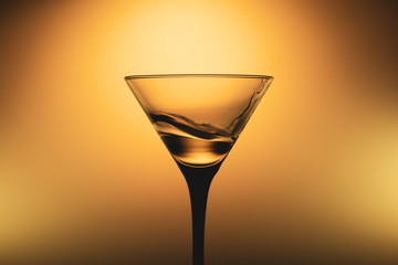 Martini glass with water splash. transparent cocktail