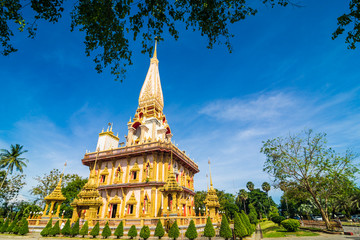 Naklejka premium Chalong buddhist temple against blue sky in Phuket Thailand