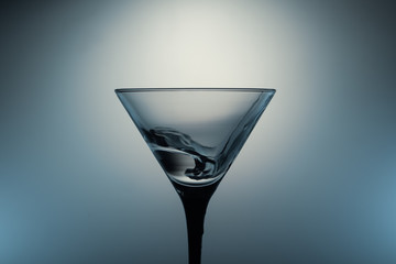 Martini glass with water splash. transparent cocktail