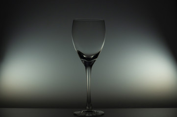 Empty wine glass stands on the table