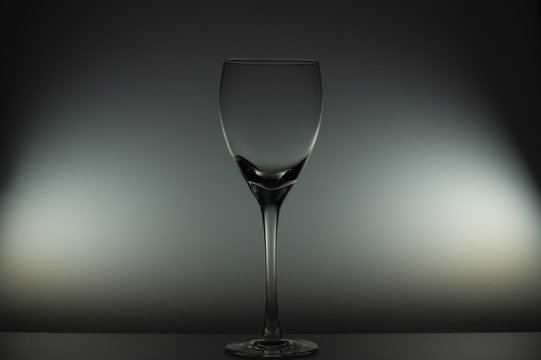 Empty wine glass stands on the table