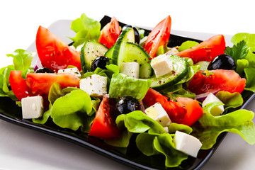  Fresh greek salad on white background