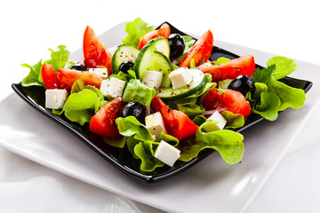  Fresh greek salad on white background