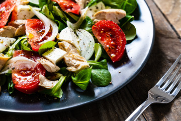 Tasty salad - vegetables , feta cheese and barbecue chicken fillet