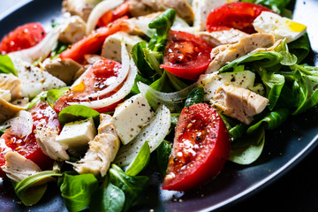Tasty salad - vegetables , feta cheese and barbecue chicken fillet