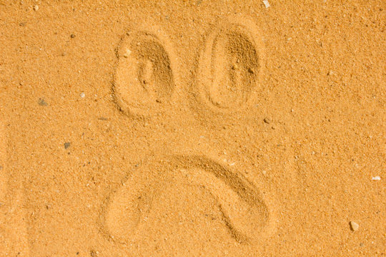 sad face images  emotion Draw on the sand and nature
